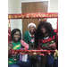 Beaufort staff memebers posing in their Christmas sweaters holding a red frame.