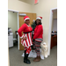 two staff members in holiday outfits